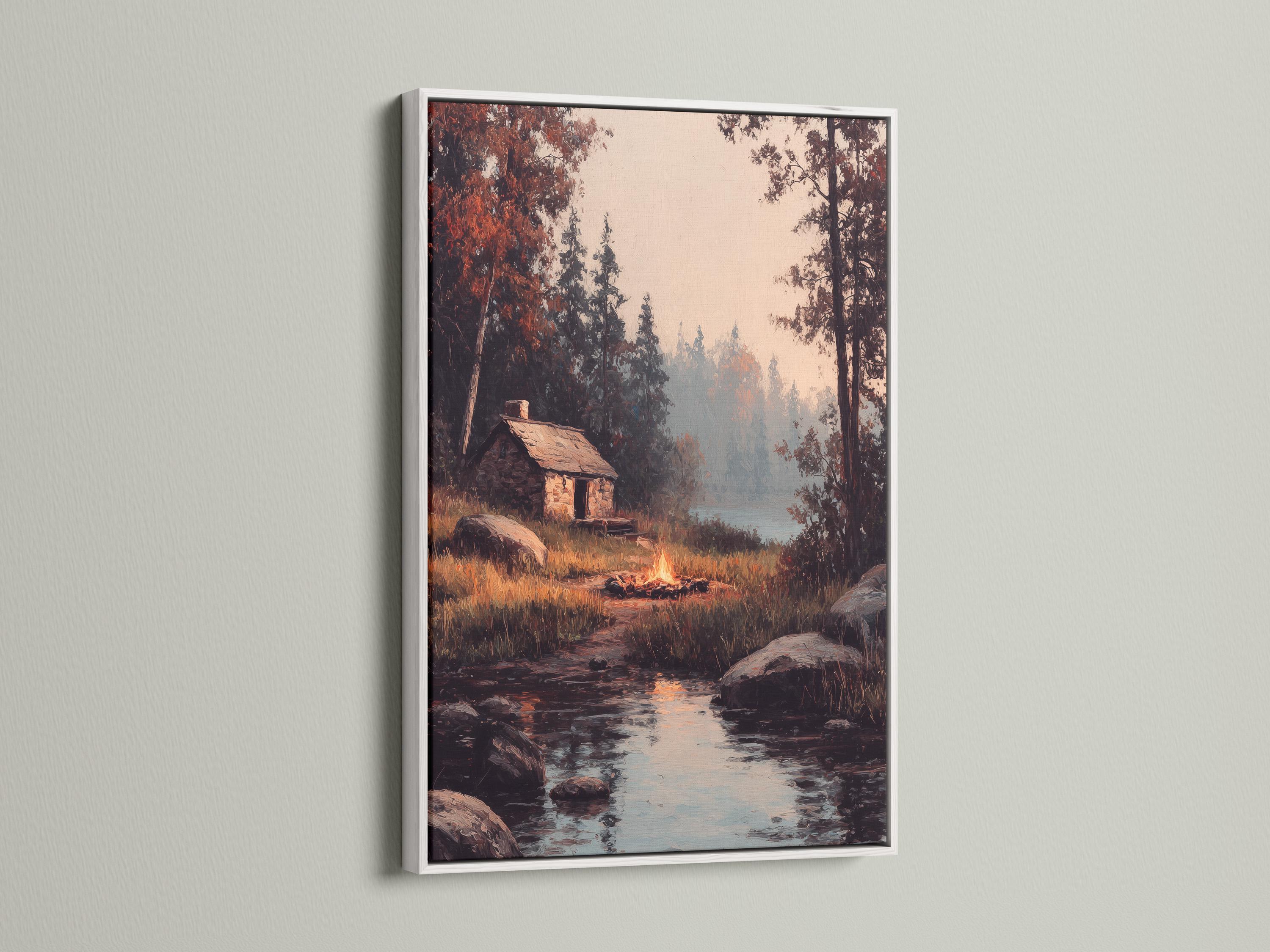 Wood-framed artwork of a rustic cabin scene in a product mockup view