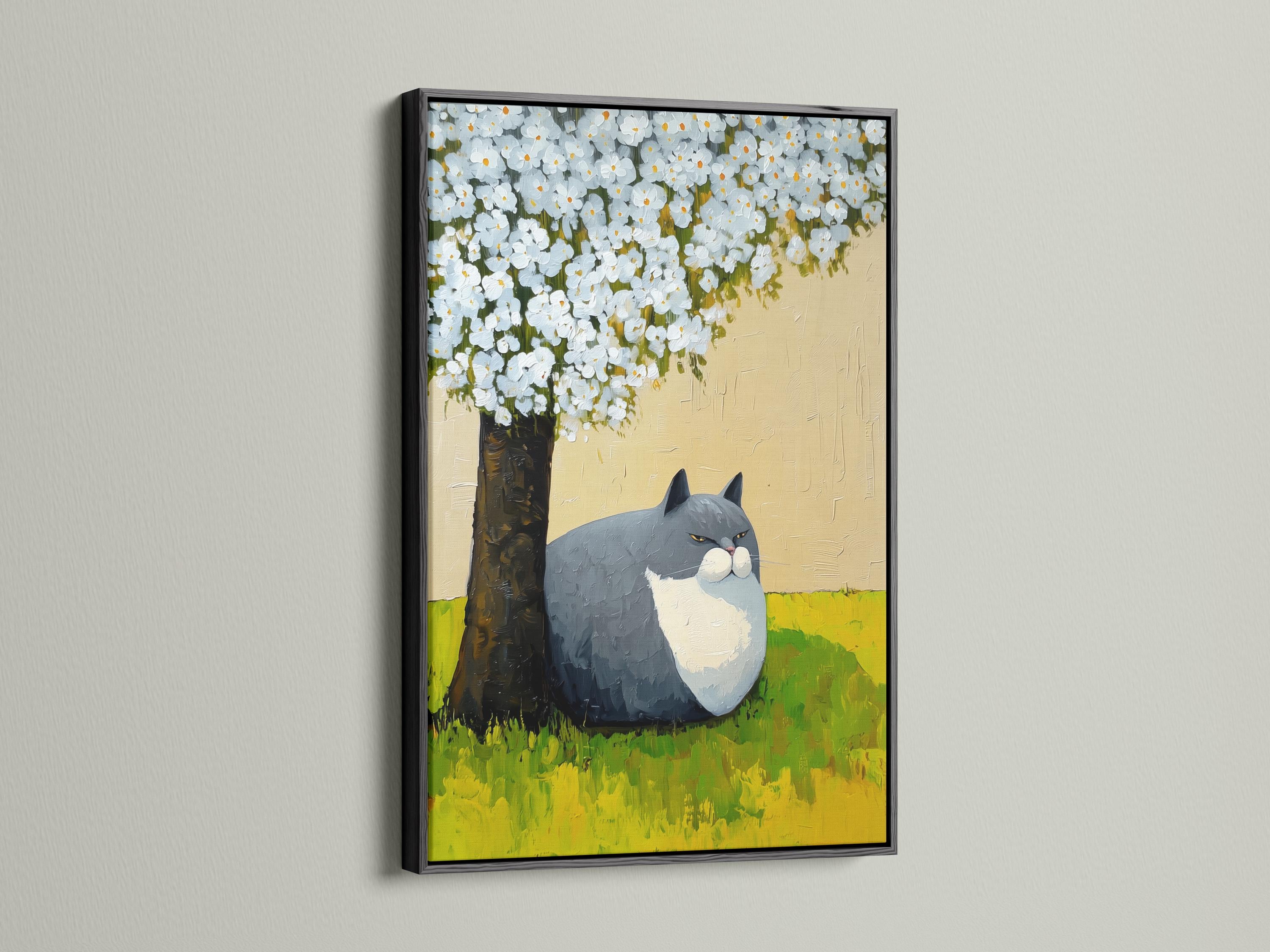 Grey and white cat lying on green grass beneath a tree with white blossoms detail view