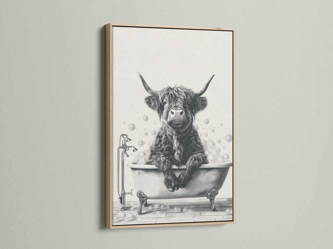 Black and white cow sitting in a bathtub with bubbles and a faucet detail view