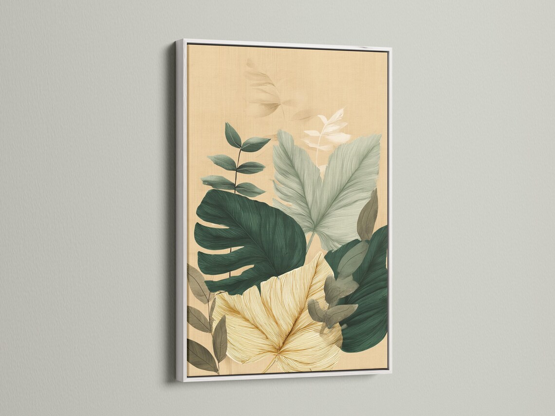 Framed botanical artwork featuring tropical leaves in green and teal on a beige background