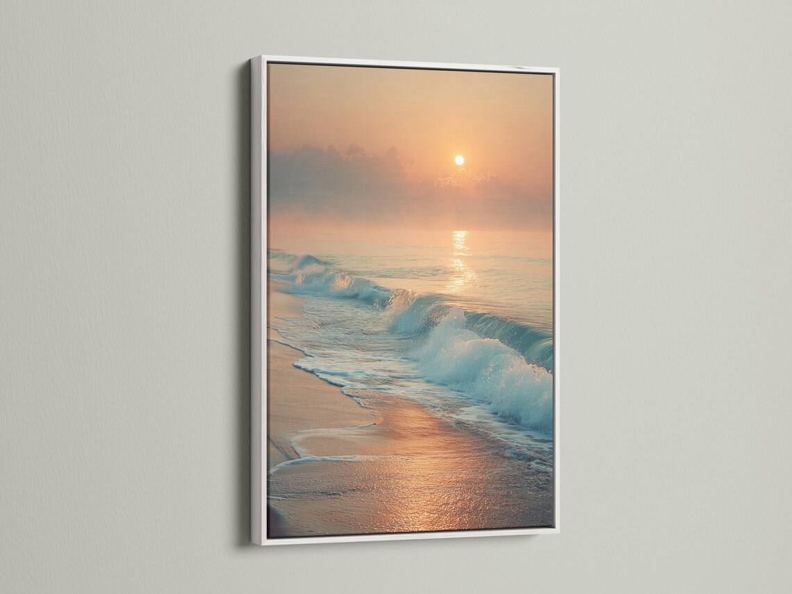 A sunrise seascape shows a glowing sun above layered clouds, with ocean waves rolling onto a sandy shore and reflecting warm light detail view