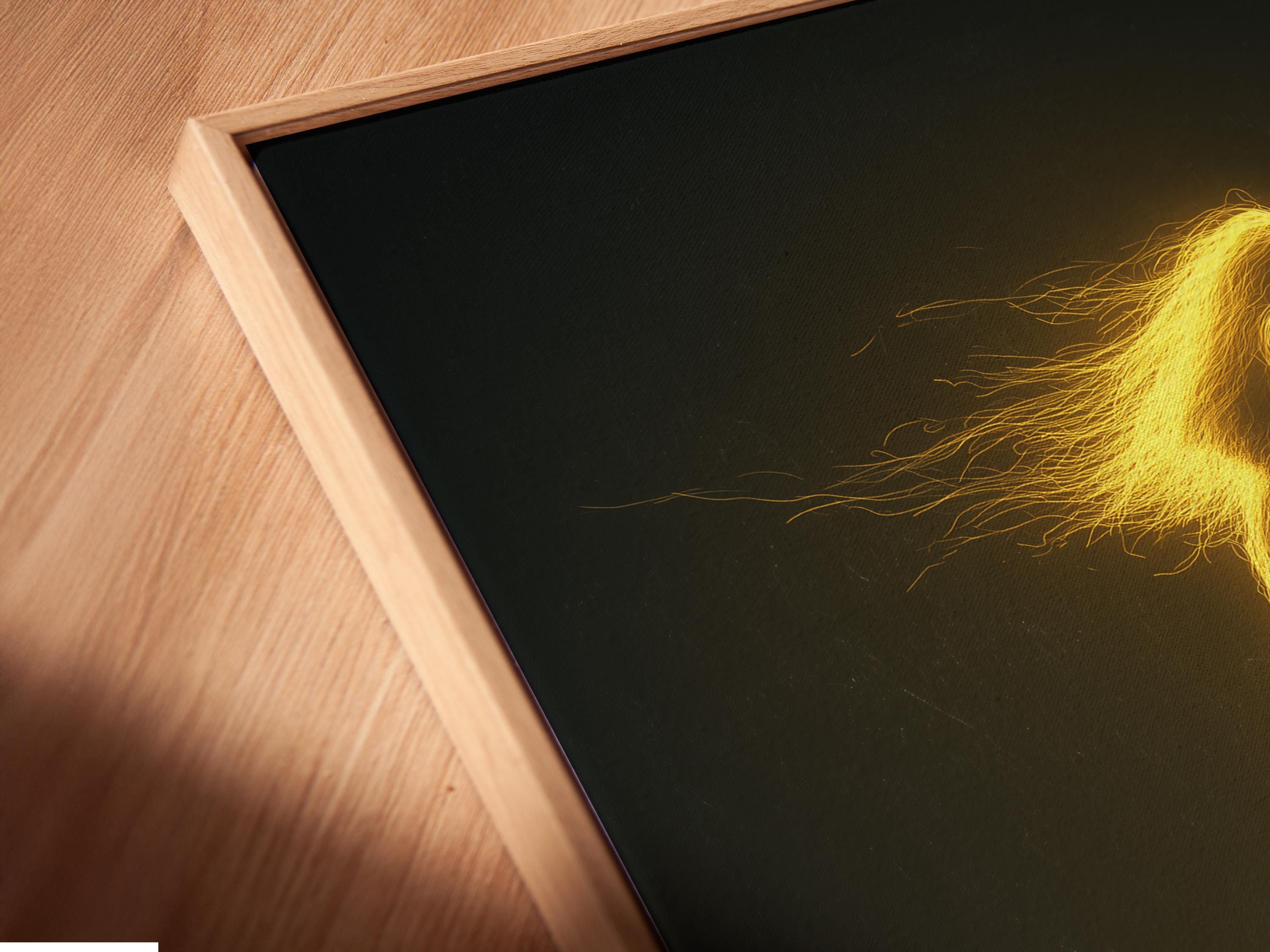 Neon gold outline guitar player with a glowing halo and electric guitar on a dark background detail view