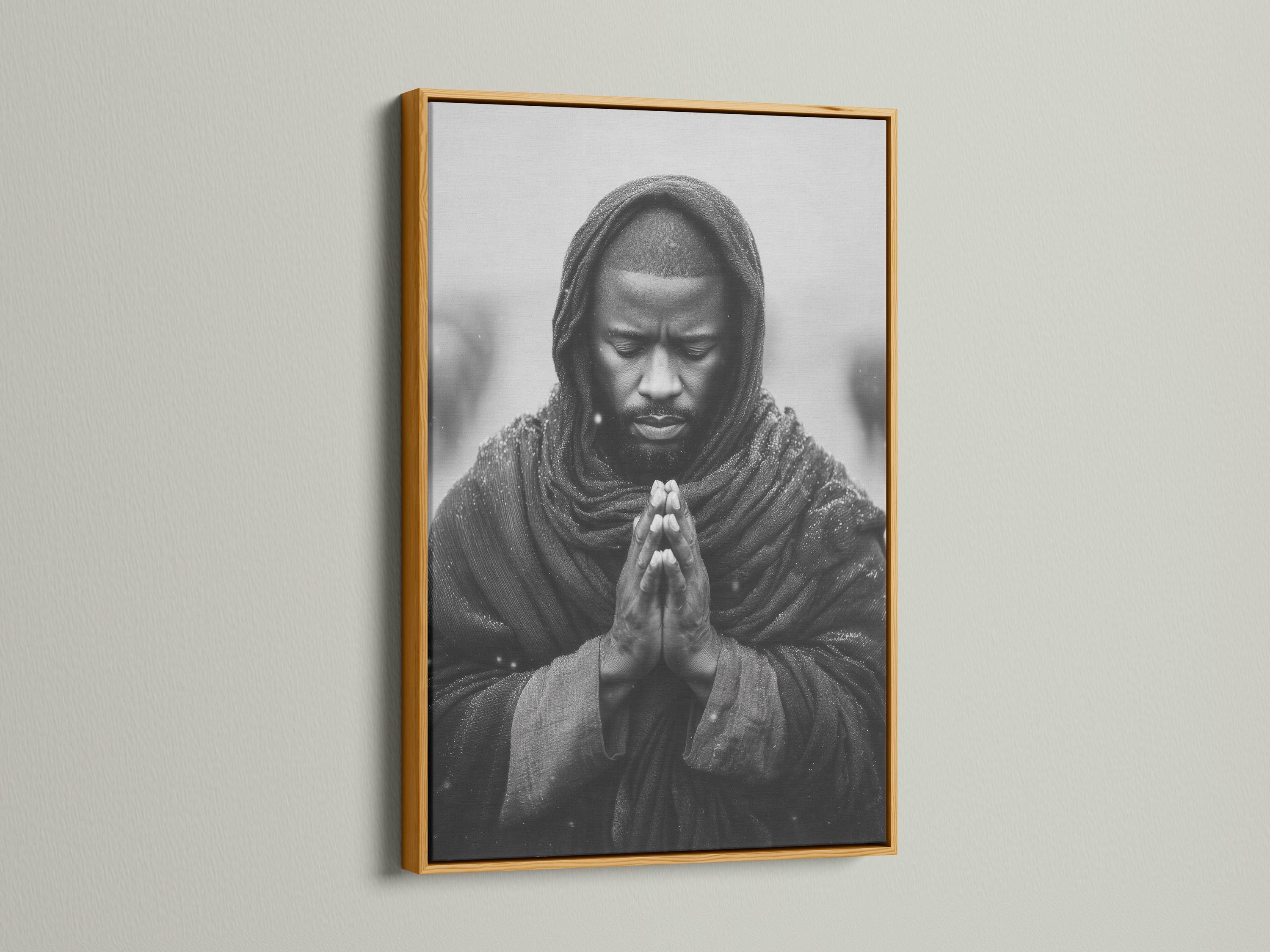 Room mockup showing a framed monochrome praying man portrait on a light background