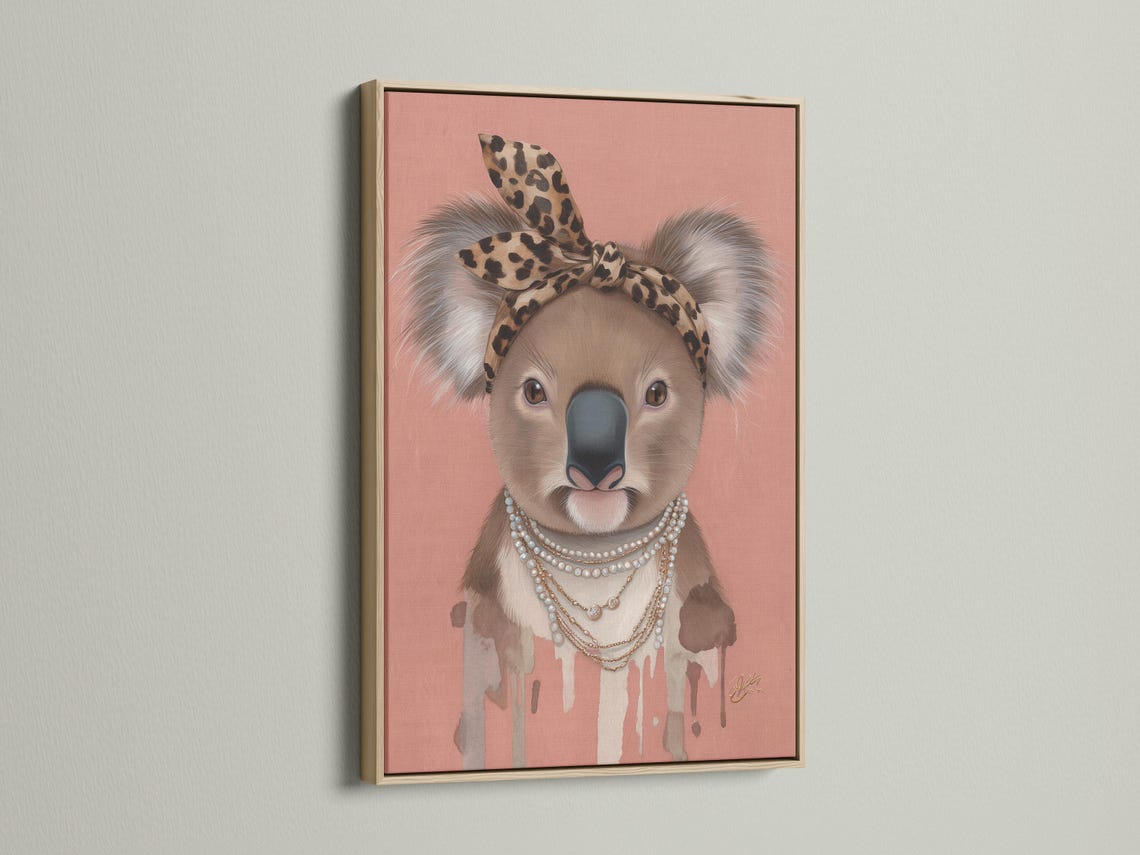 Koala portrait with leopard headband and pearl necklace on a dusty pink background detail view