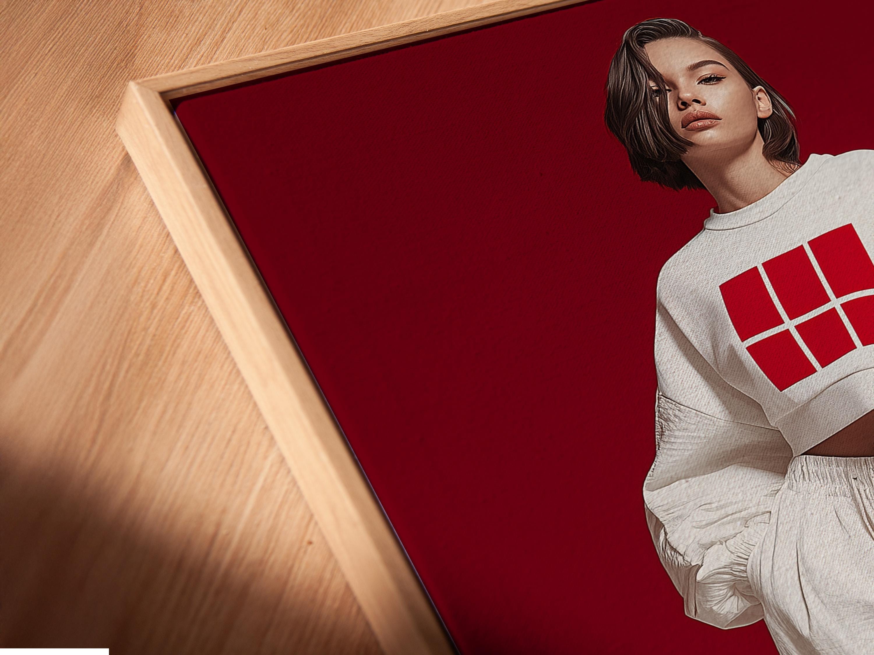 Stylised fashion portrait of a woman in white streetwear with a grid logo on a deep red background detail view