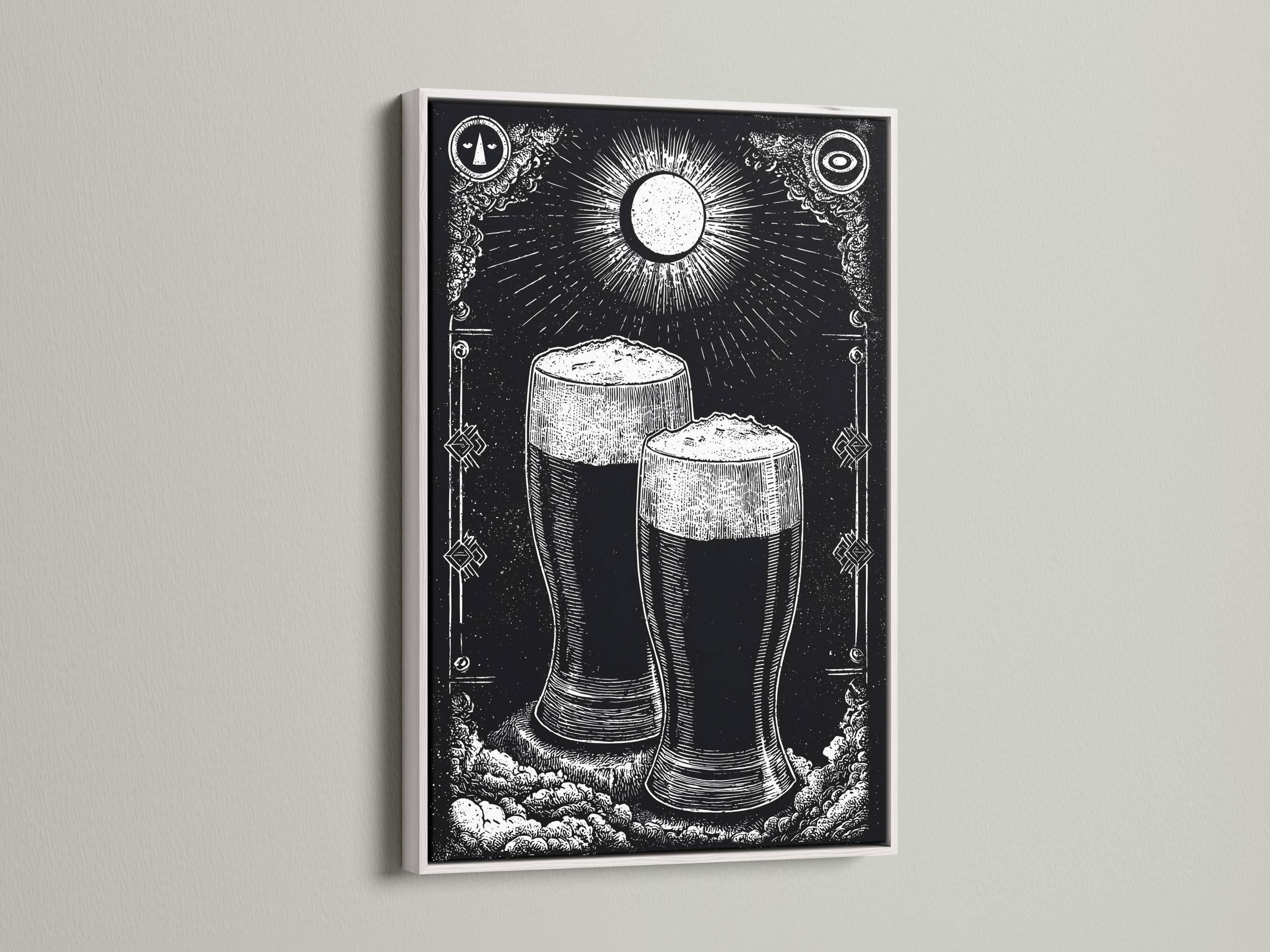 Person holding a framed black-and-white beer mug illustration in a workshop-style bar setting