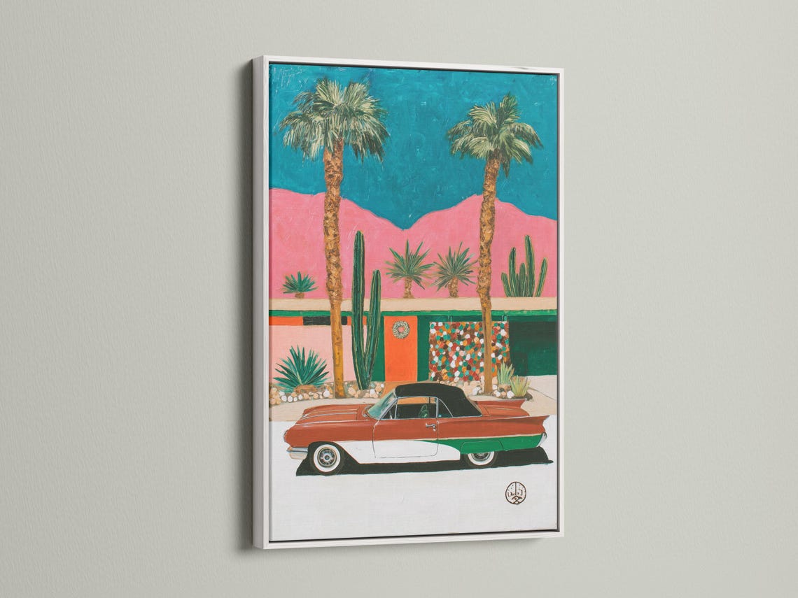 Retro car in a desert scene with palm trees, cacti, and teal and pink background detail view