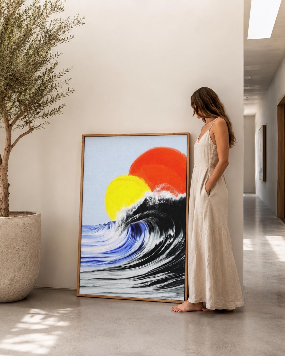 Room mockup showing a framed abstract ocean artwork on a wall near an open window and lounge area