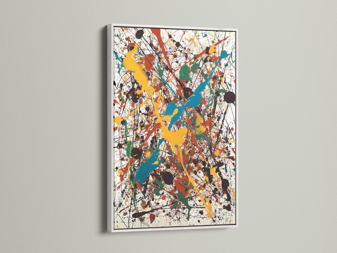 Abstract splatter artwork with layered blue, teal, yellow, red and green shapes on a white background detail view