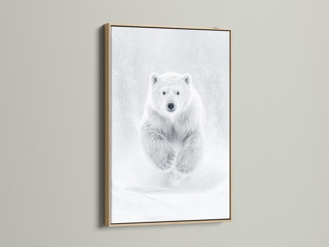 Room mockup showing a framed monochrome polar bear running artwork