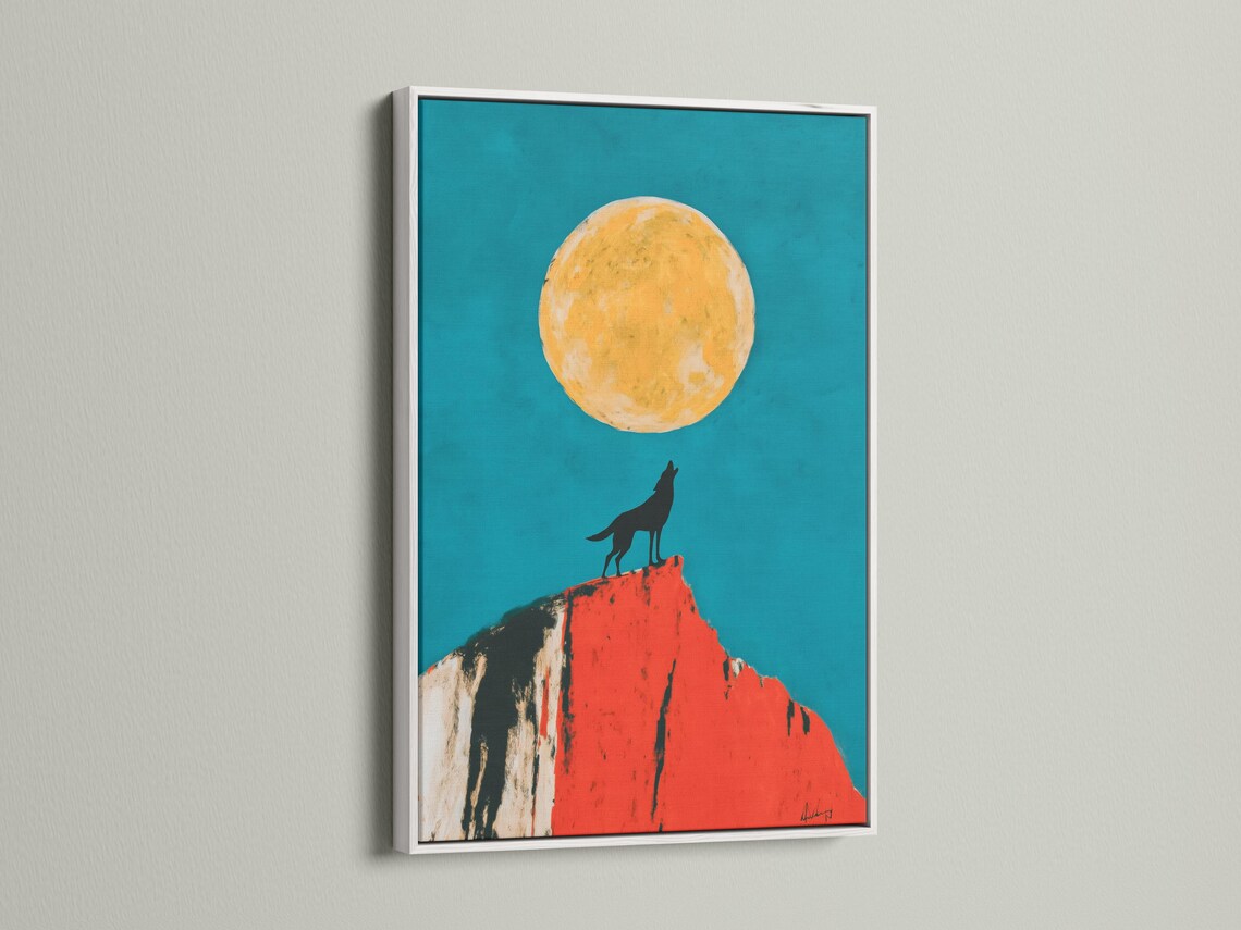 Mockup showing framed wolf moon artwork with a teal background, wolf silhouette and red cliff