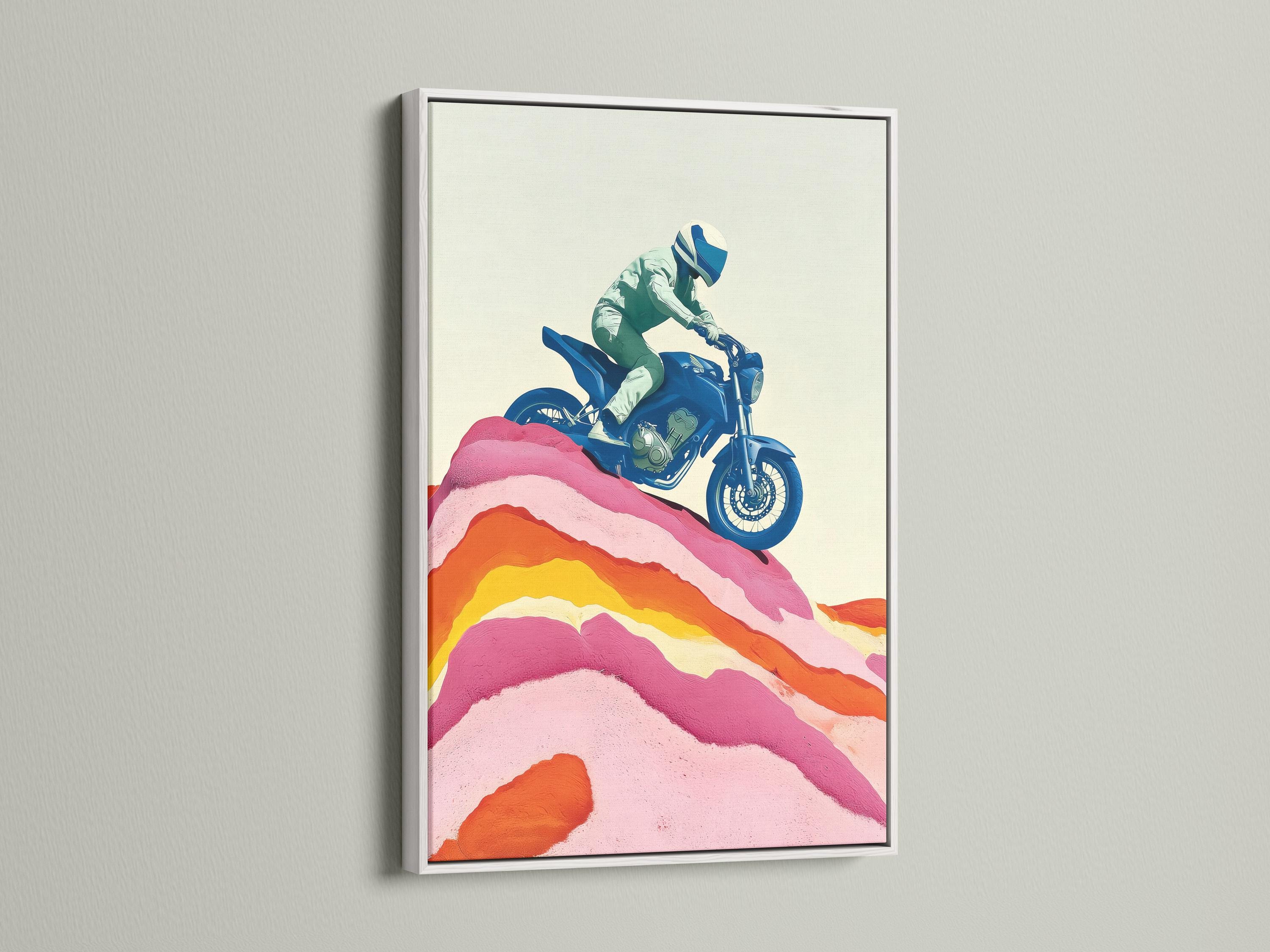 Framed wall mockup showing a stylised blue motorcycle rider over pink and orange mountain ridges