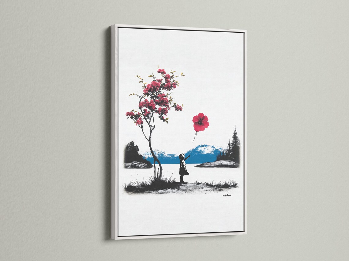Room mockup showing a framed artwork of a silhouetted girl holding a red balloon in a black-and-white landscape