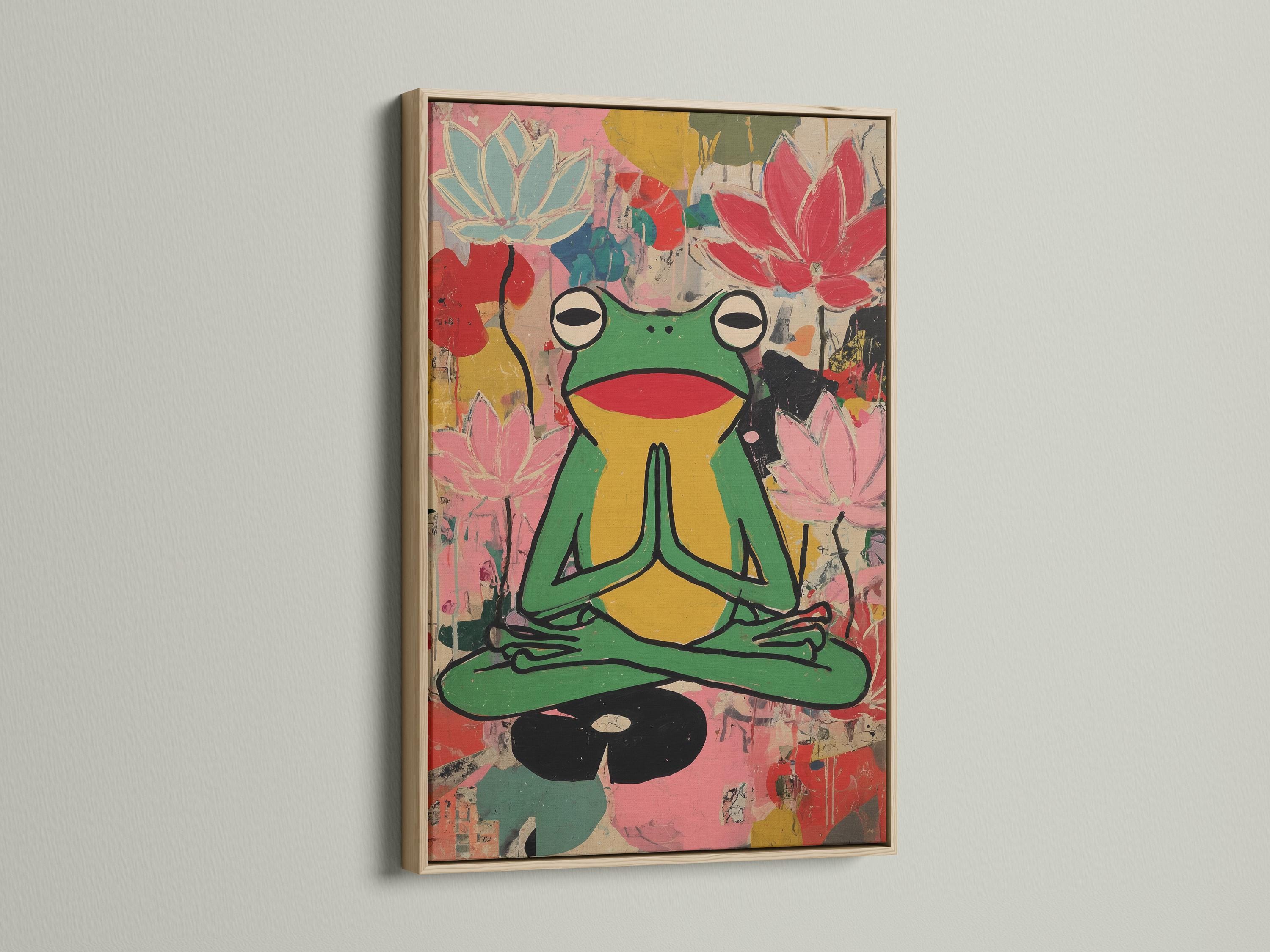 Stylised green frog meditating with pink lotus flowers in a colourful collage background detail view