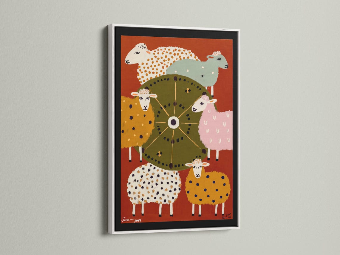 Colourful folk-style sheep illustration with a central wheel motif on a warm orange background detail view