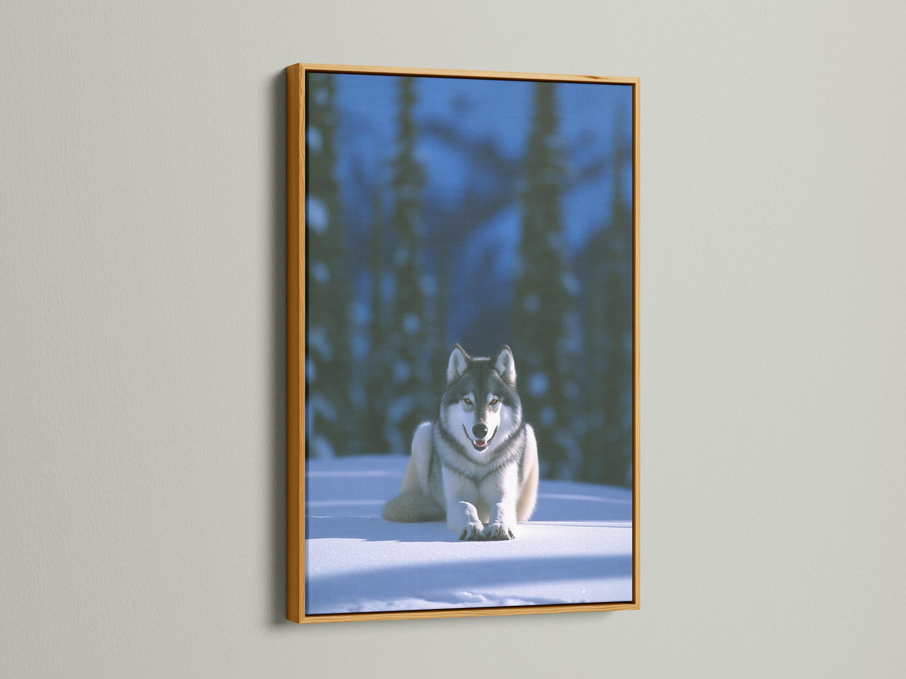 Grey wolf reclining on snow in a softly blurred winter forest detail view