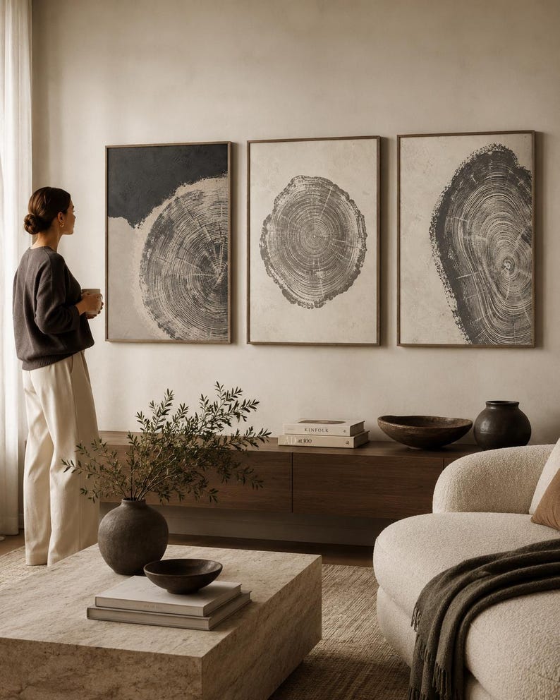 Three-panel abstract tree-ring circles in grey linework on neutral backgrounds