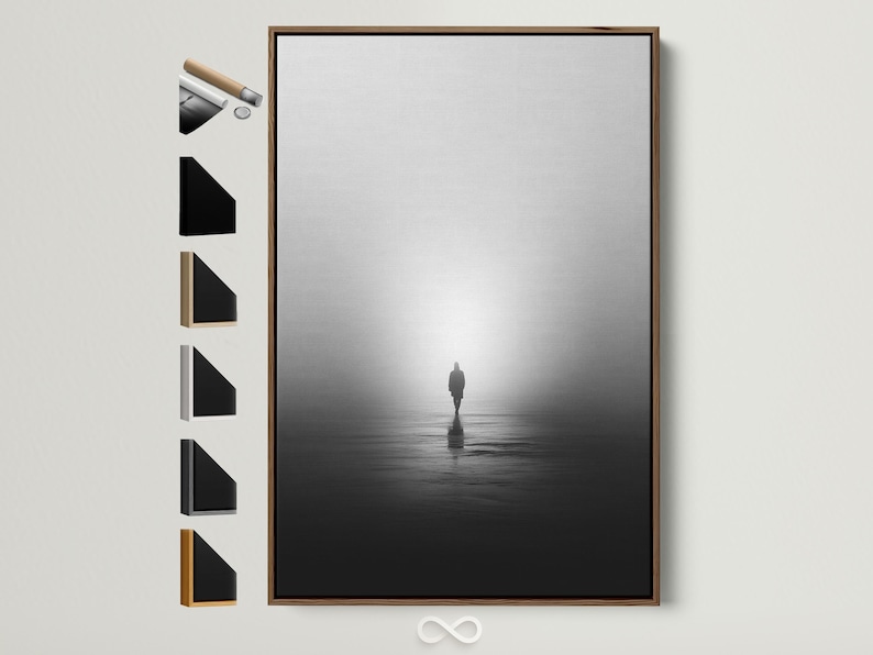 Monochrome misty shore scene with a solitary standing figure and reflection on dark water