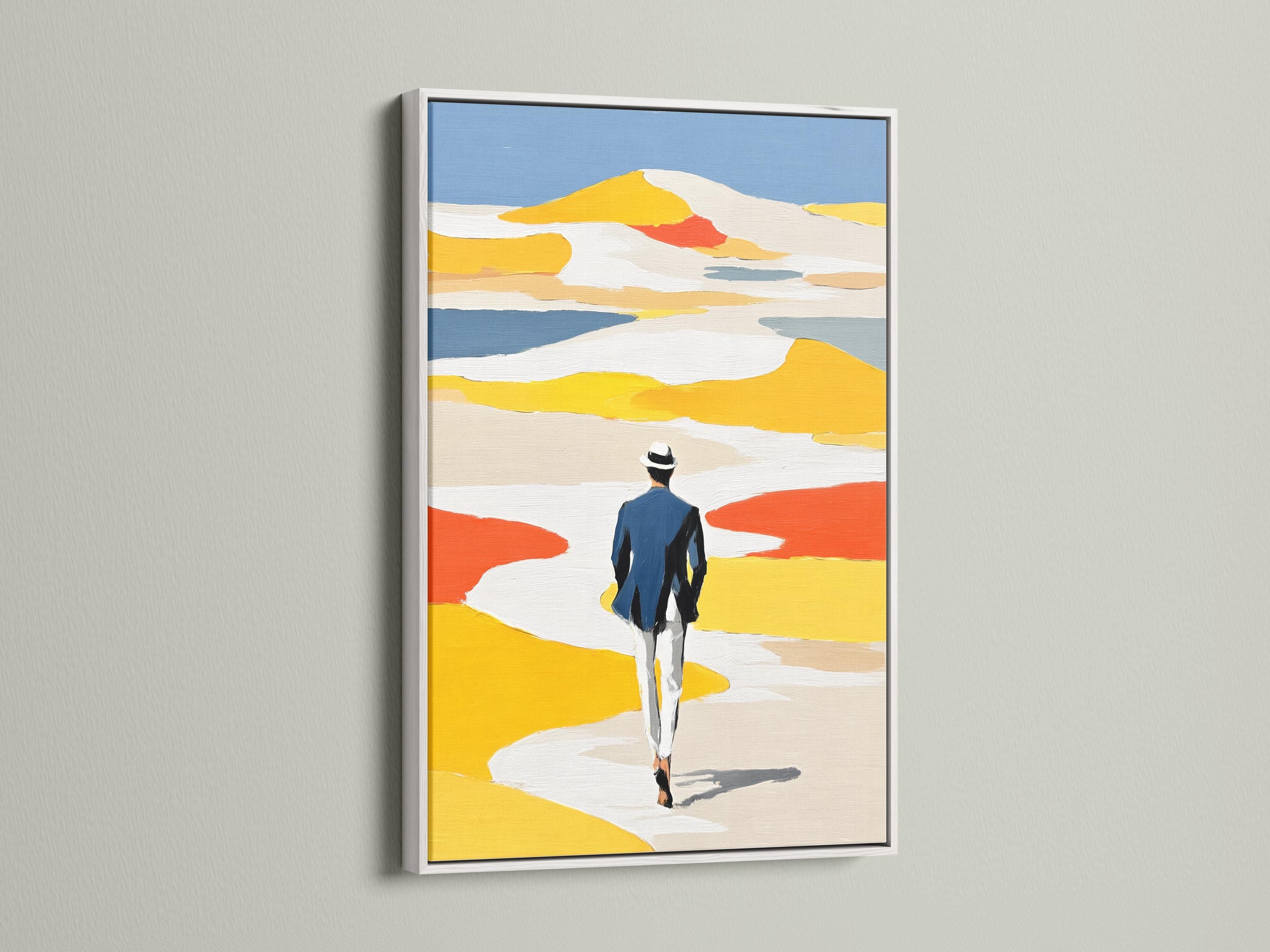 Room mockup featuring framed coastal beach artwork with a person walking away in yellow dunes
