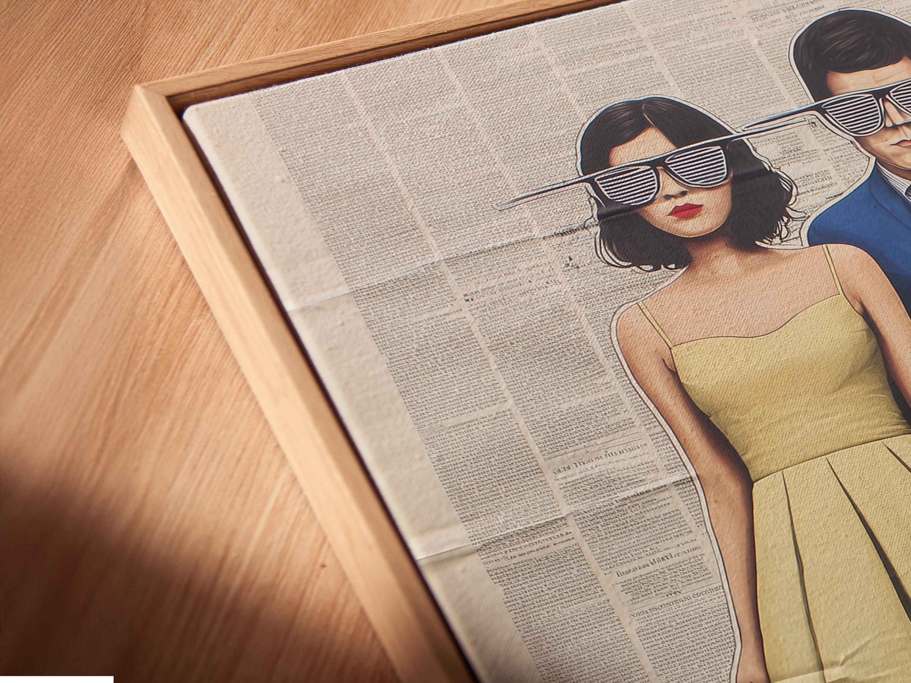 Wall mockup showing framed retro couple artwork with newspaper-text background