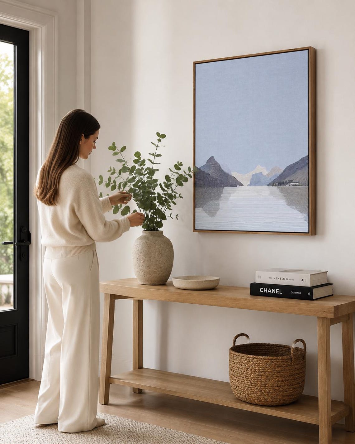 Person viewing an abstract mountain artwork in a modern room mockup