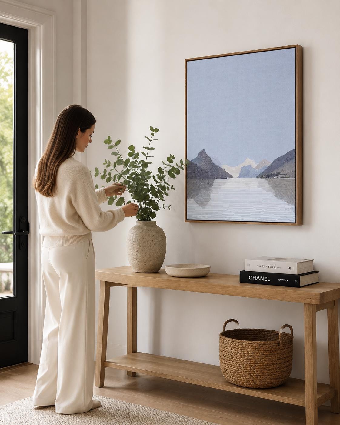 Person viewing an abstract mountain artwork in a modern room mockup