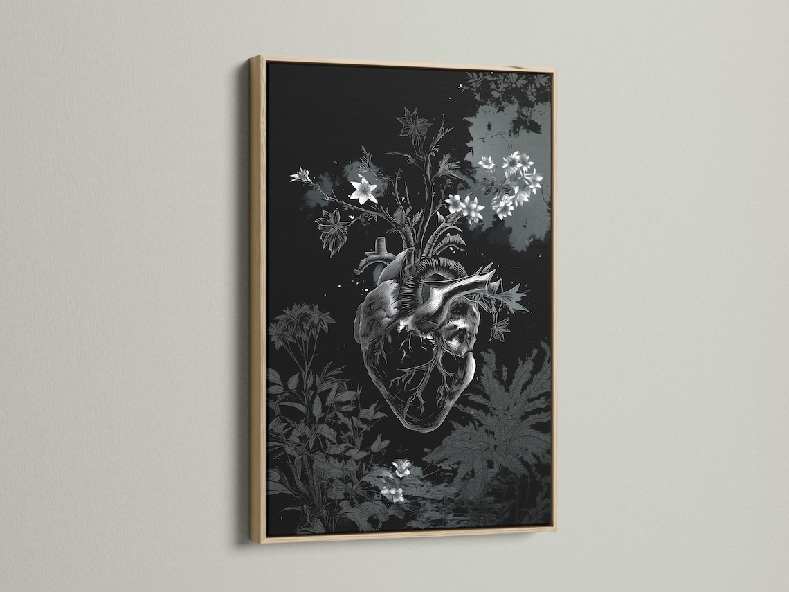 Room mockup showing a framed monochrome botanical heart artwork on a wall