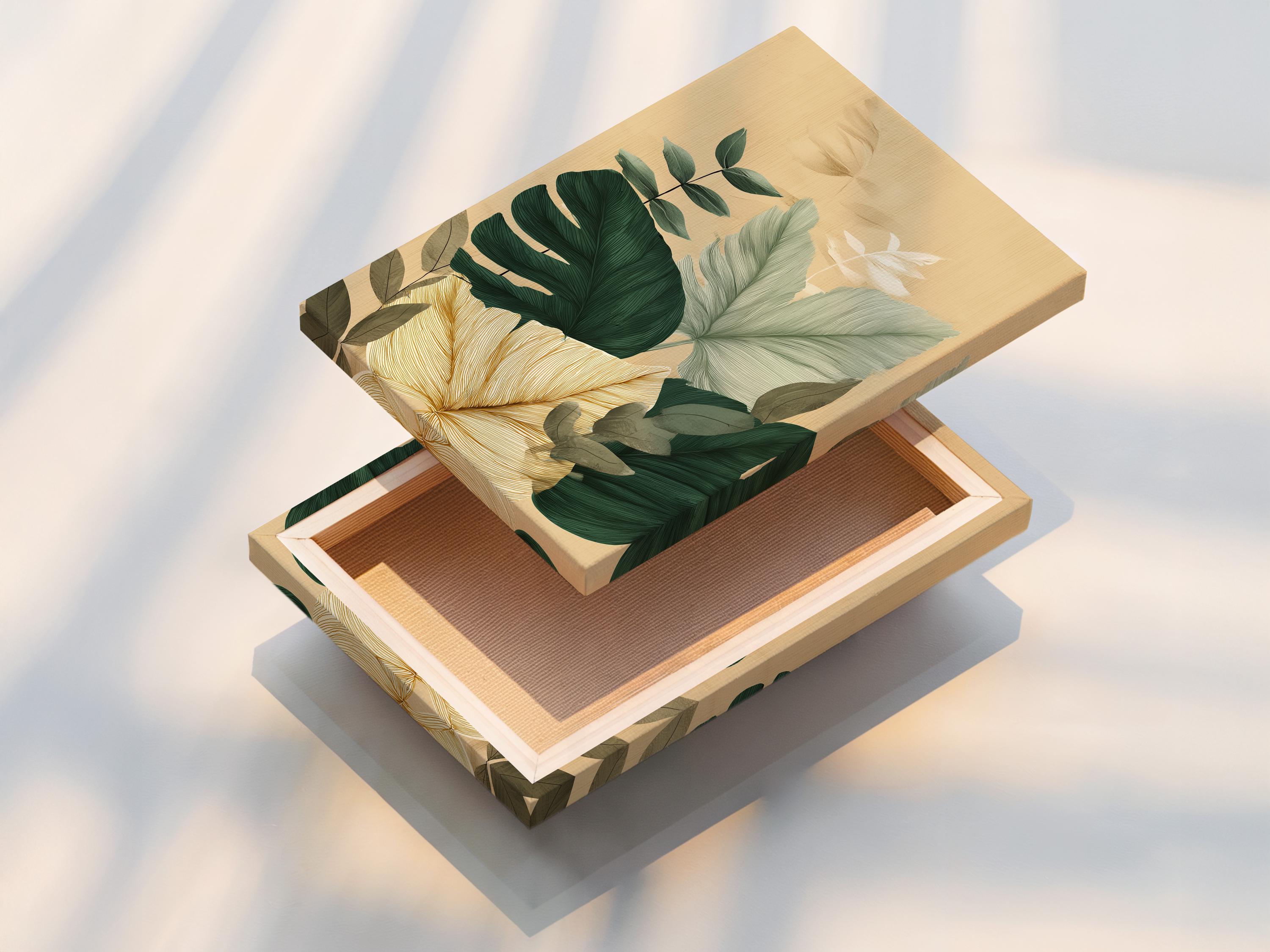 Framed botanical artwork featuring tropical leaves in green and teal on a beige background