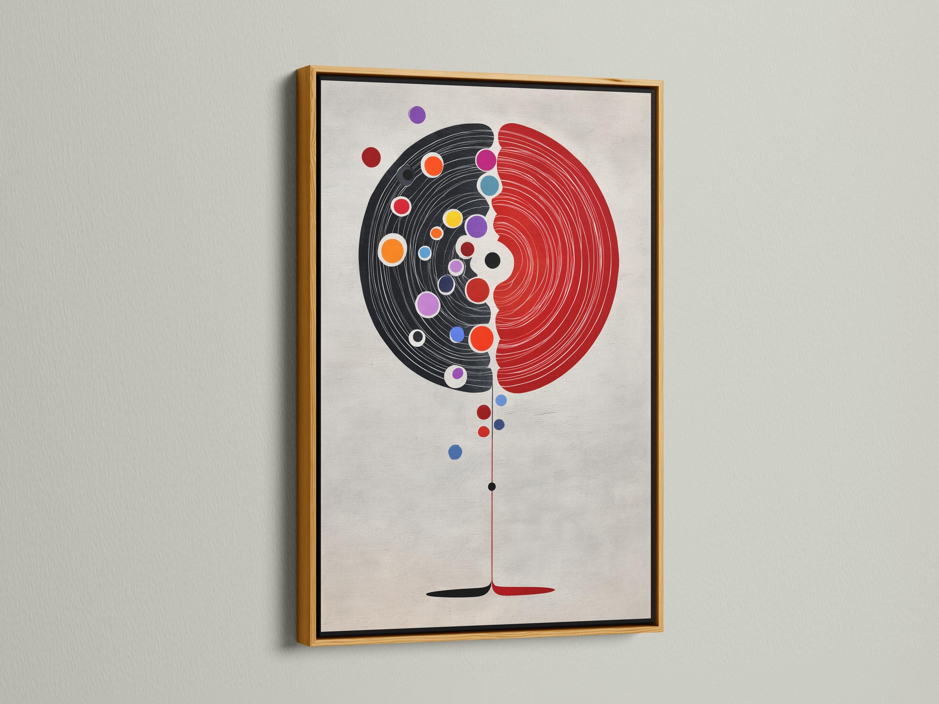 Abstract split circle design with red and black concentric arcs and colourful dot accents detail view