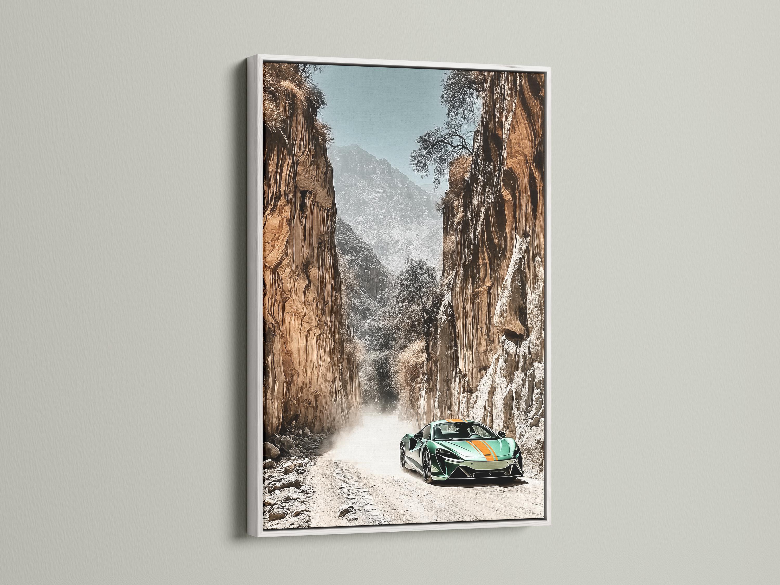 Green sports car on a sandy path in a rocky desert canyon with misty mountains detail view
