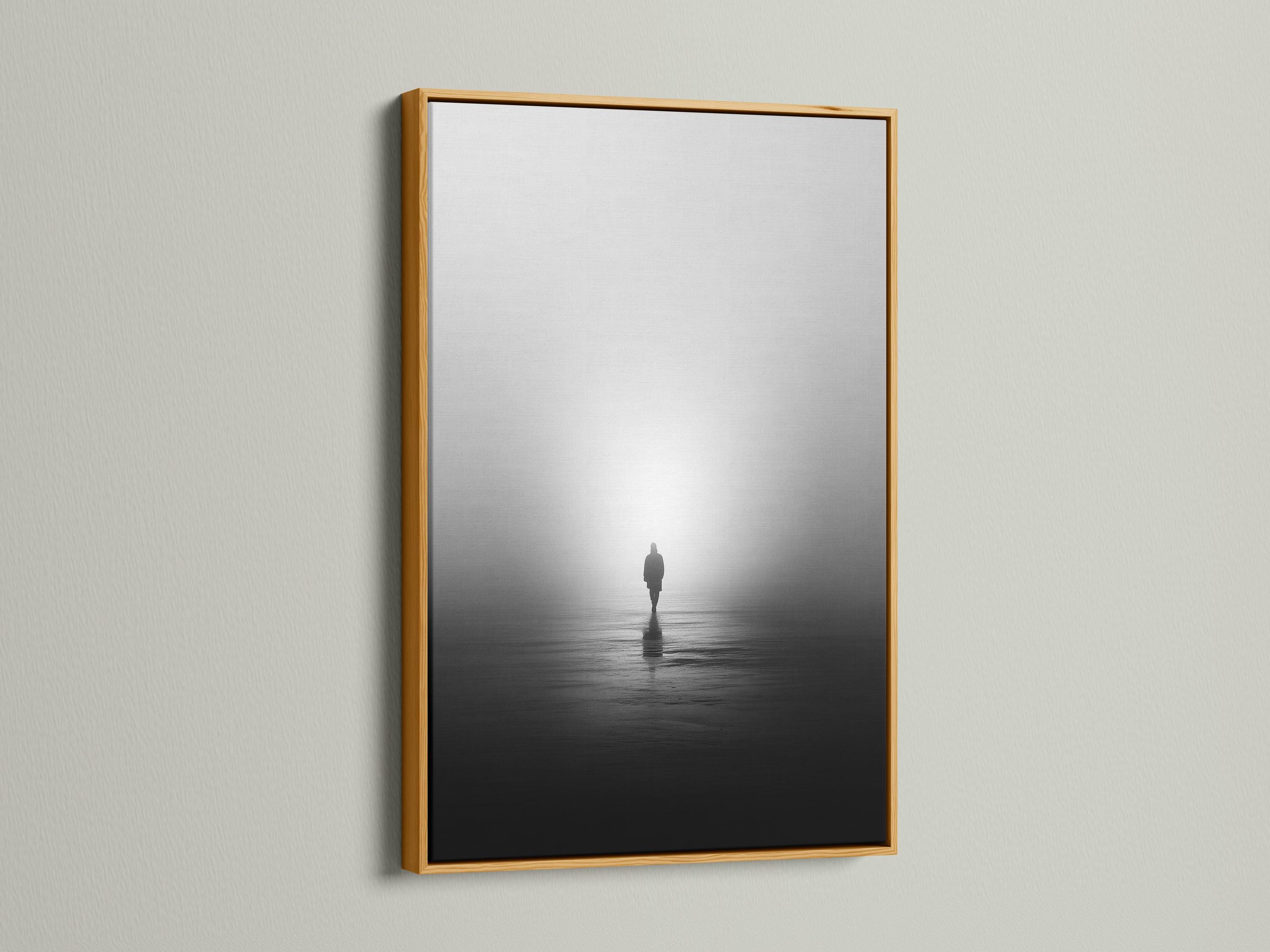 Monochrome misty shore scene with a solitary standing figure and reflection on dark water detail view