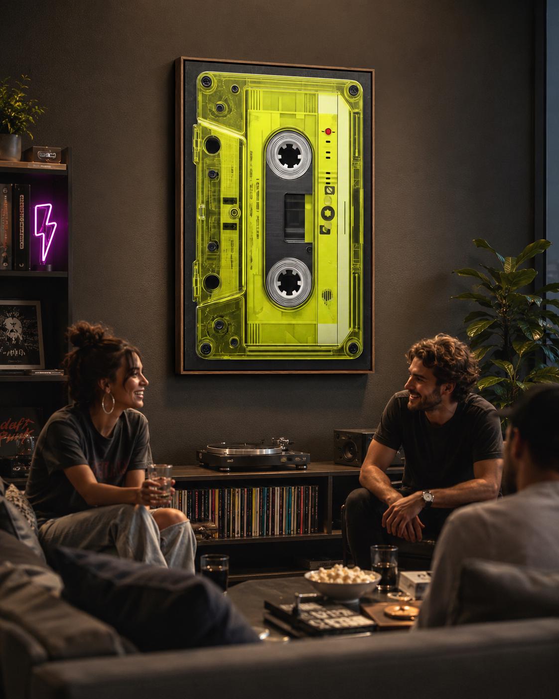 Neon lime cassette tape graphic framed in black with spool circles and a red dot detail detail view