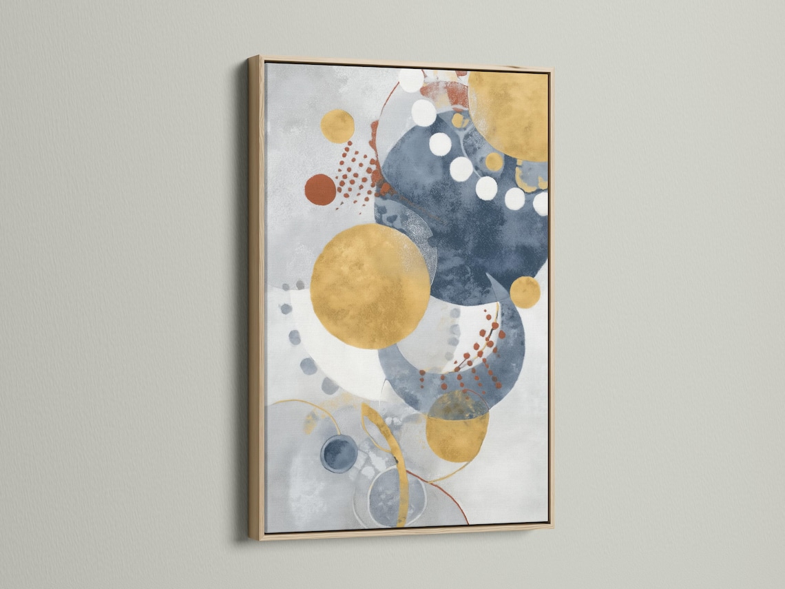 Abstract navy blue and mustard gold circle artwork shown in a framed mockup on a light background