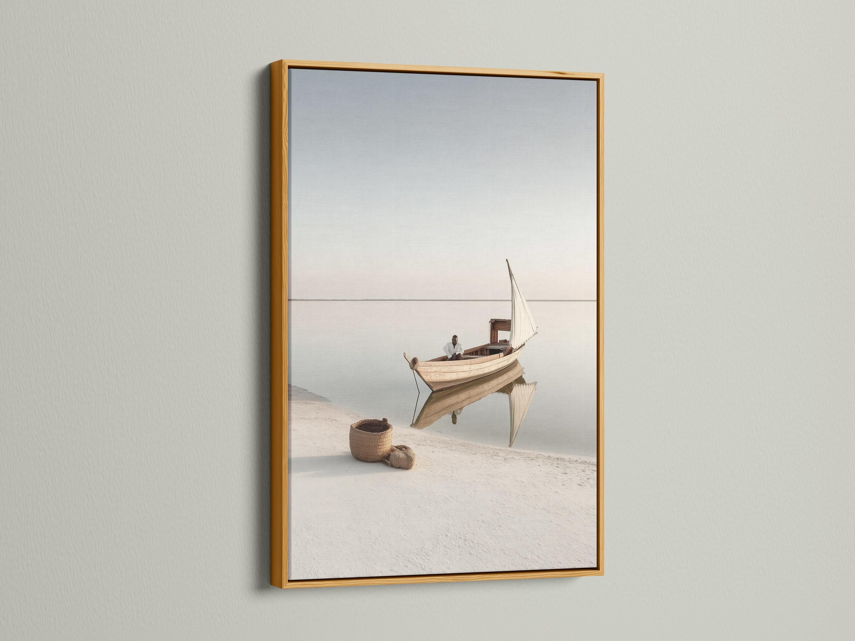 Neutral sailboat seascape with a pale sail on calm water and a hazy horizon detail view