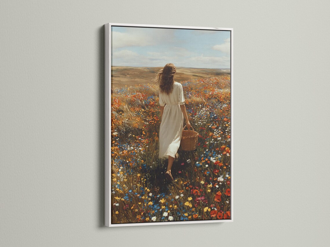Mockup showing framed wildflower meadow artwork with a woman walking in a field of flowers