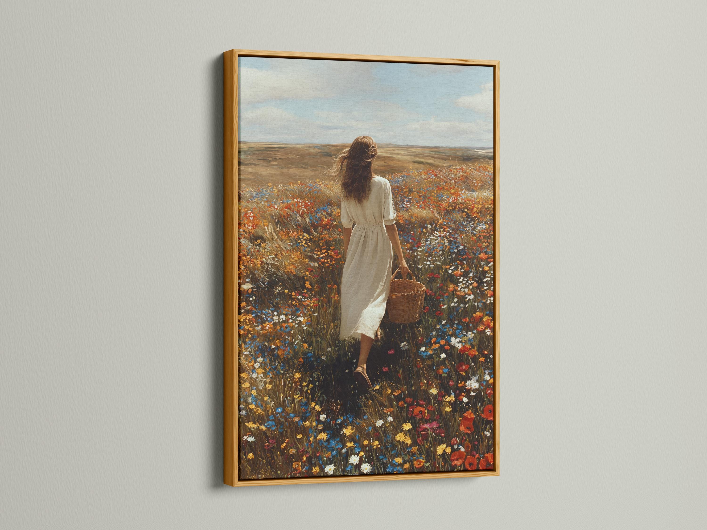 Mockup showing framed wildflower meadow artwork with a woman walking in a field of flowers