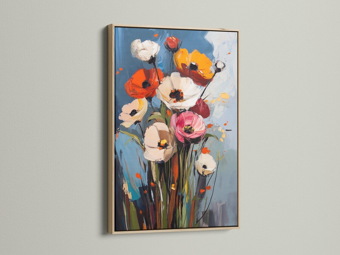 Room mockup showing framed floral artwork with poppy-like blooms and a blue background