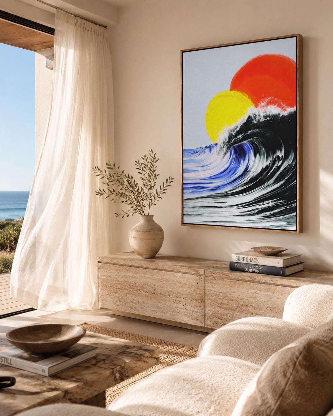Room mockup showing a framed abstract ocean artwork on a wall near an open window and lounge area