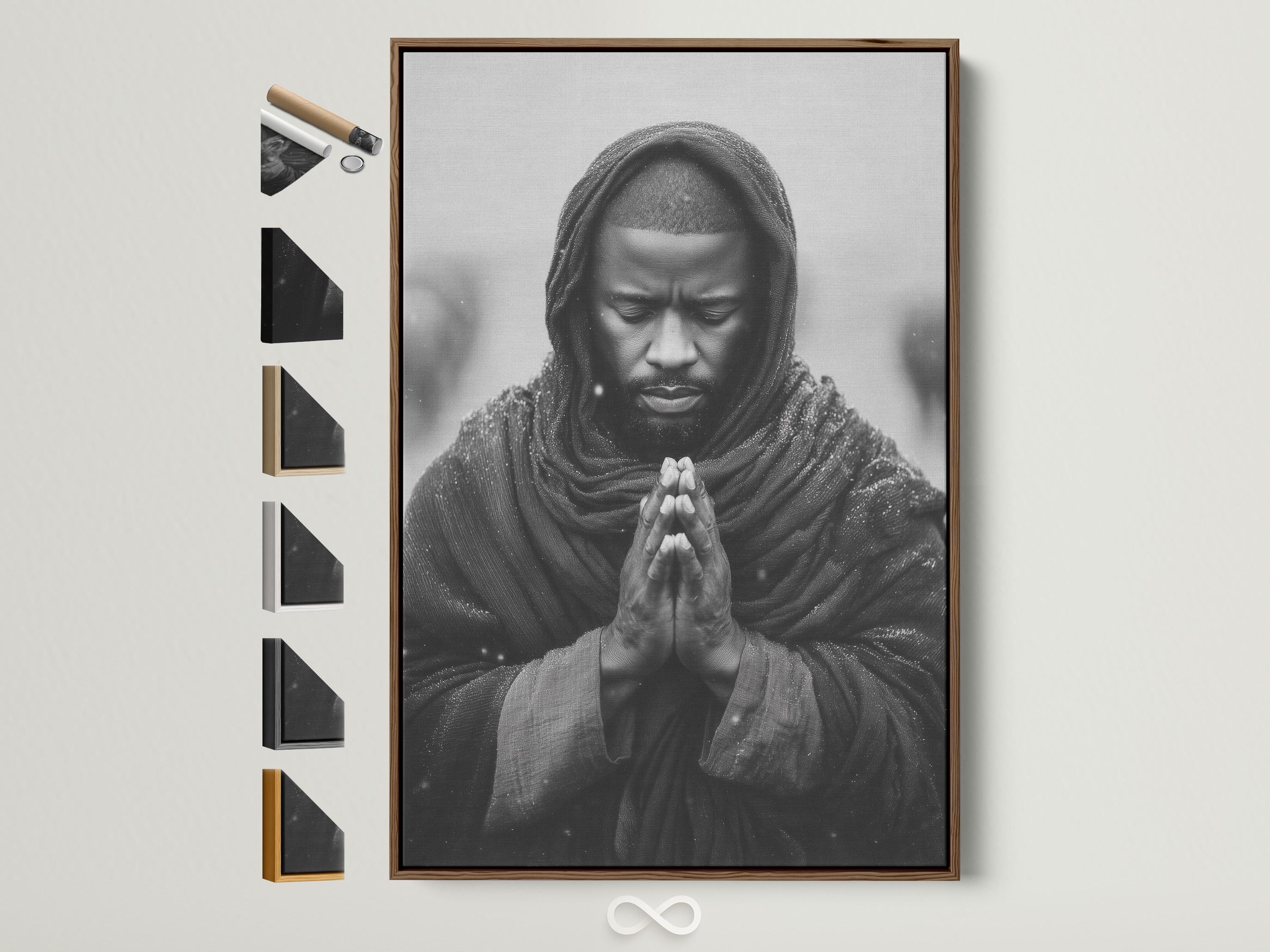 Monochrome portrait of a hooded figure praying with clasped hands