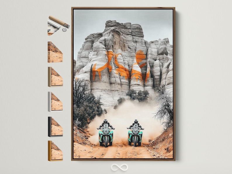 Two off-road motorcycles with turquoise accents racing through desert haze against grey cliffs