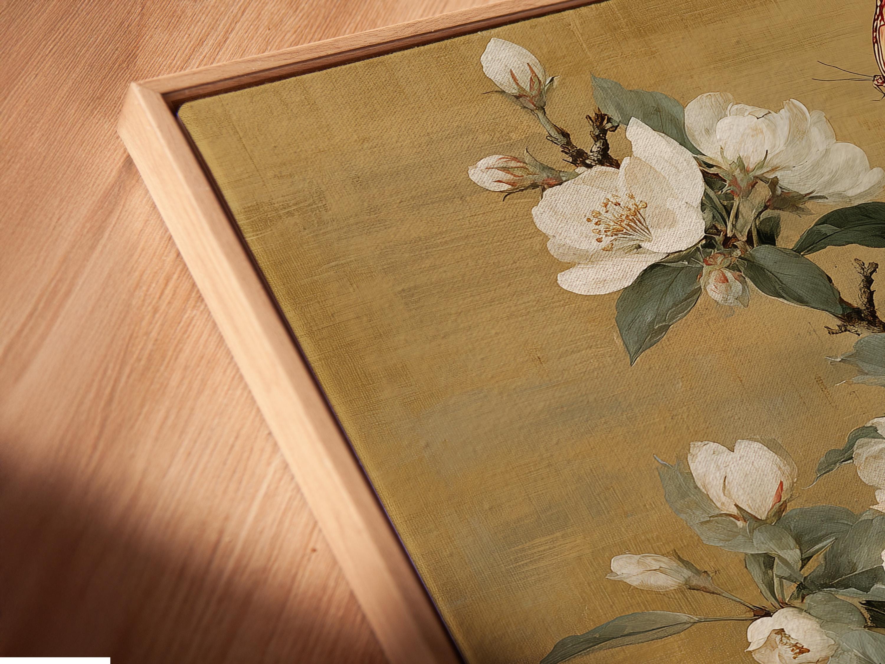 Vertical framed artwork mockup on a light wall with a bouquet of white blossoms and a butterfly