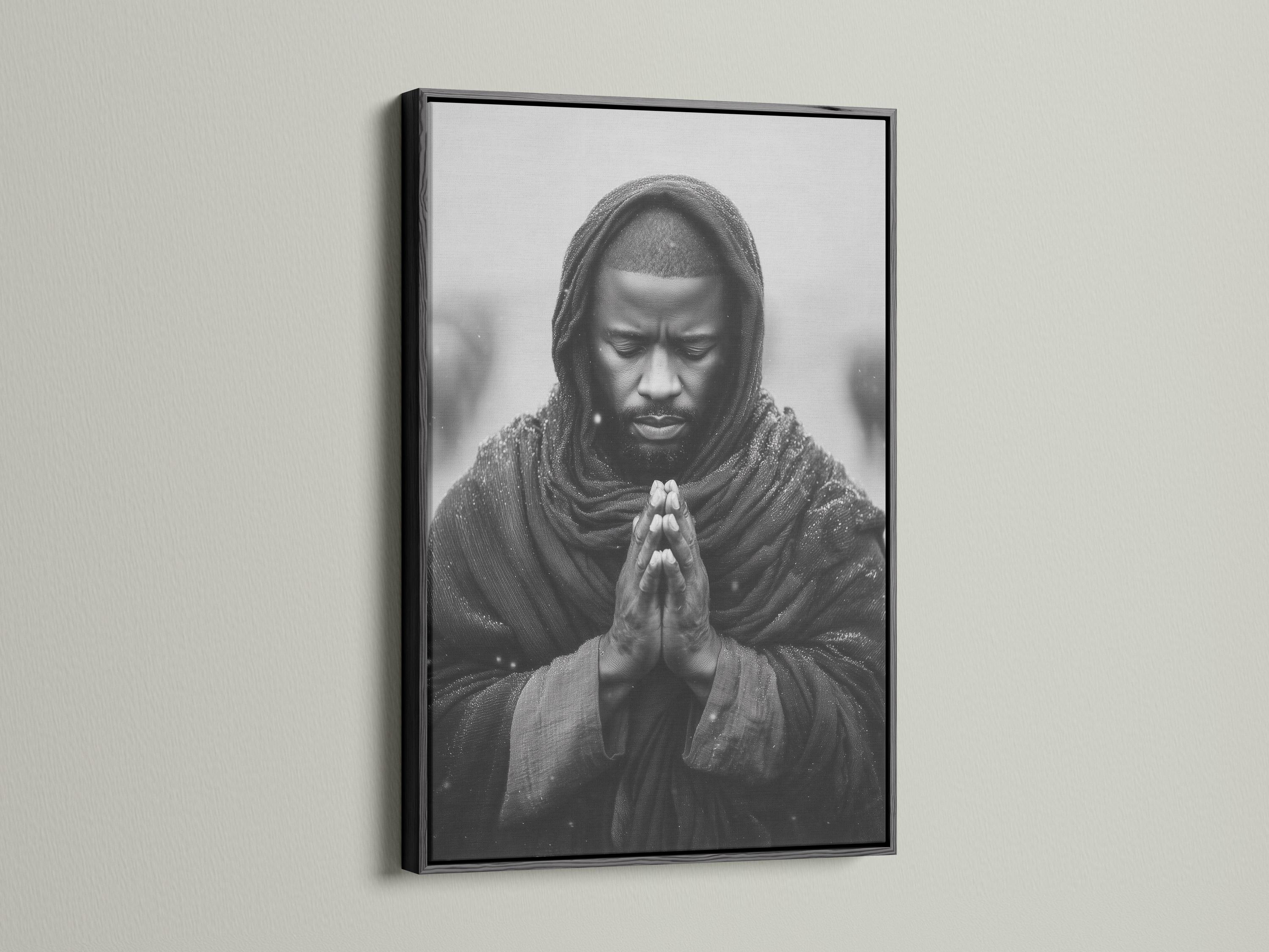 Room mockup showing a framed monochrome praying man portrait on a light background