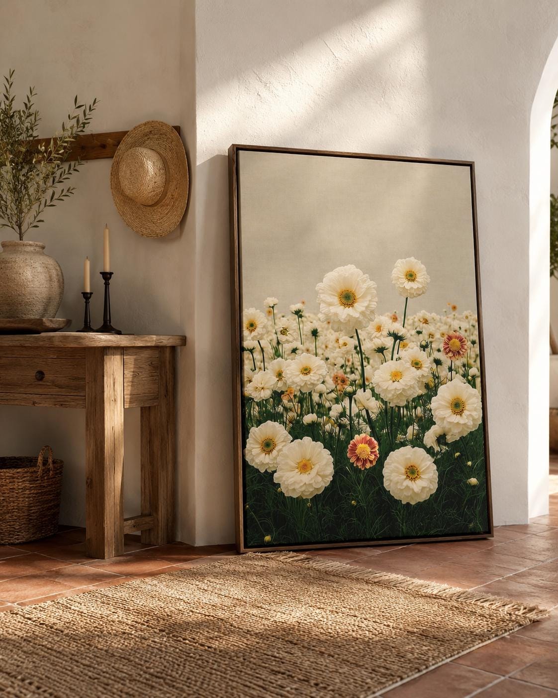 Room mockup showing a person holding flowers beside framed daisy meadow artwork