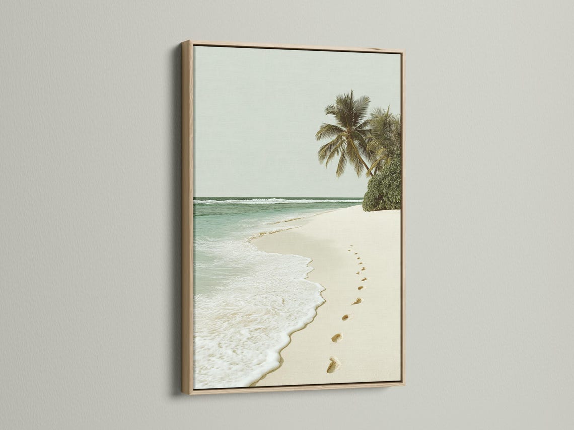 Palm beach seascape with turquoise ocean, sandy shore and footprints leading along the beach detail view