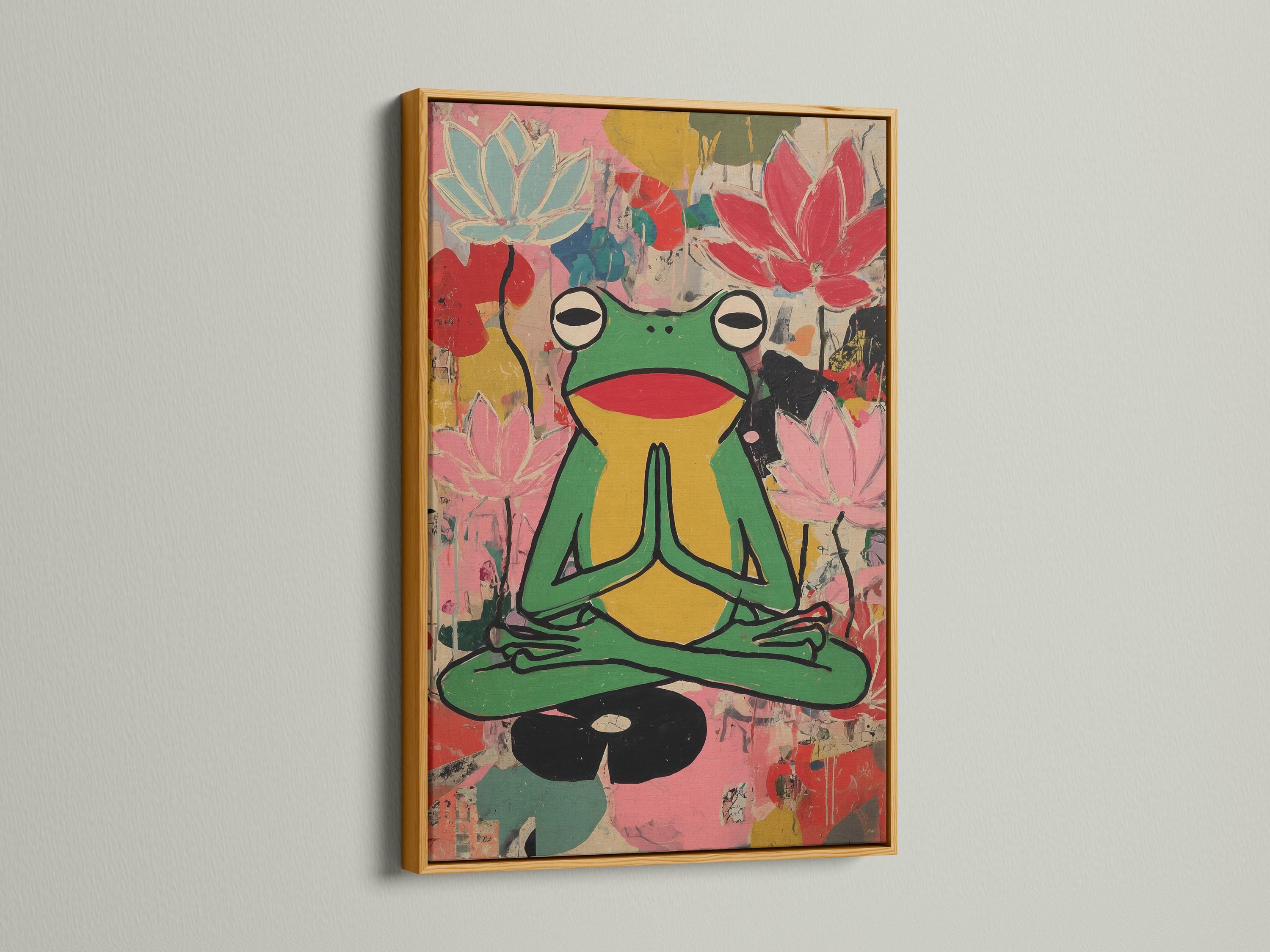 Stylised green frog meditating with pink lotus flowers in a colourful collage background detail view