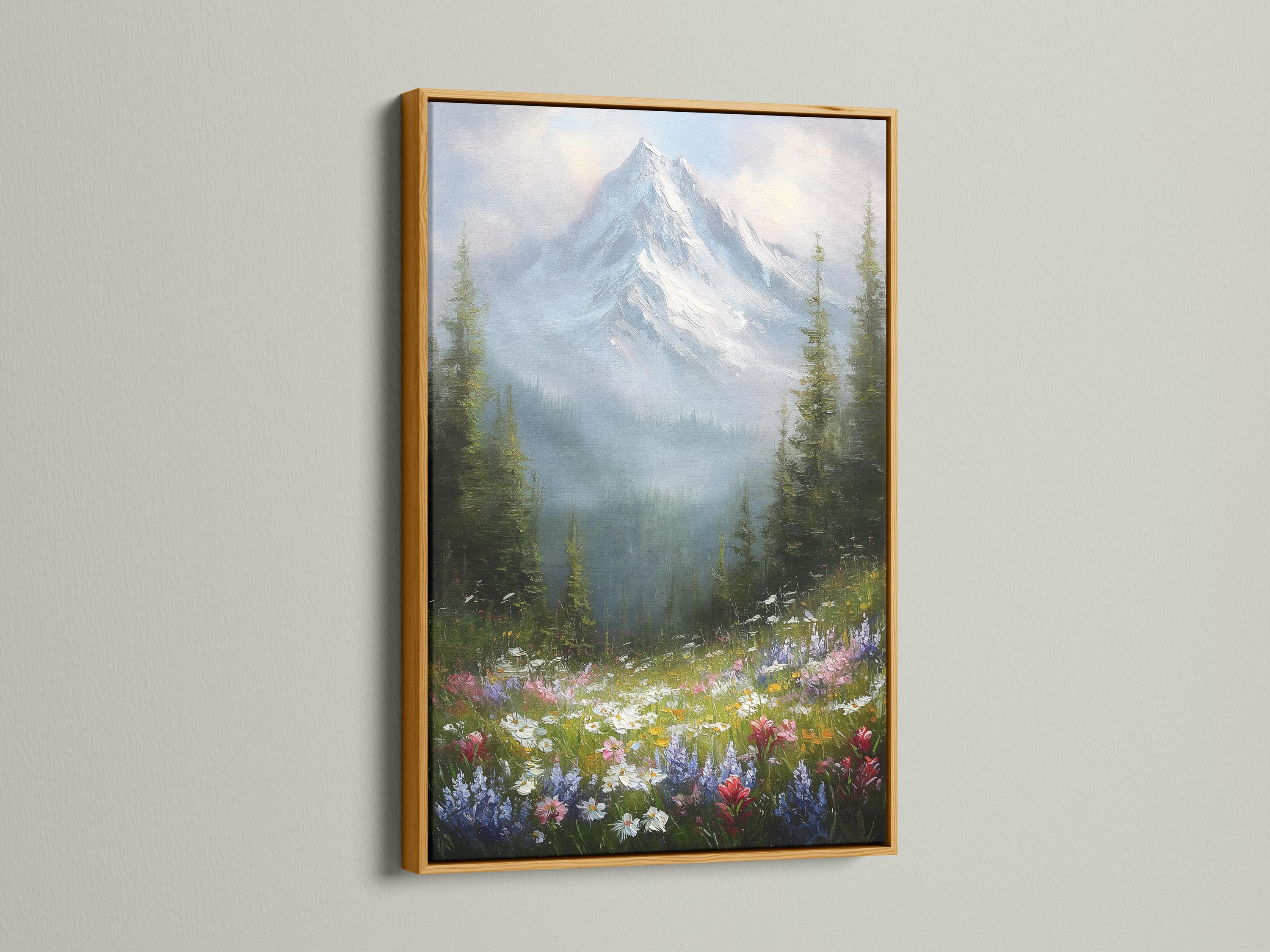 Wall mockup featuring a framed snowy mountain landscape with wildflowers and forest trees