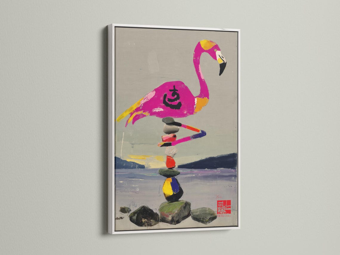 Stylised pink flamingo balancing on a stack of multicoloured stones detail view