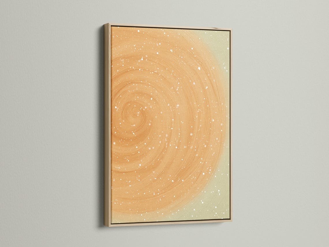 Beige abstract circular swirl with white speckles on a soft neutral background detail view