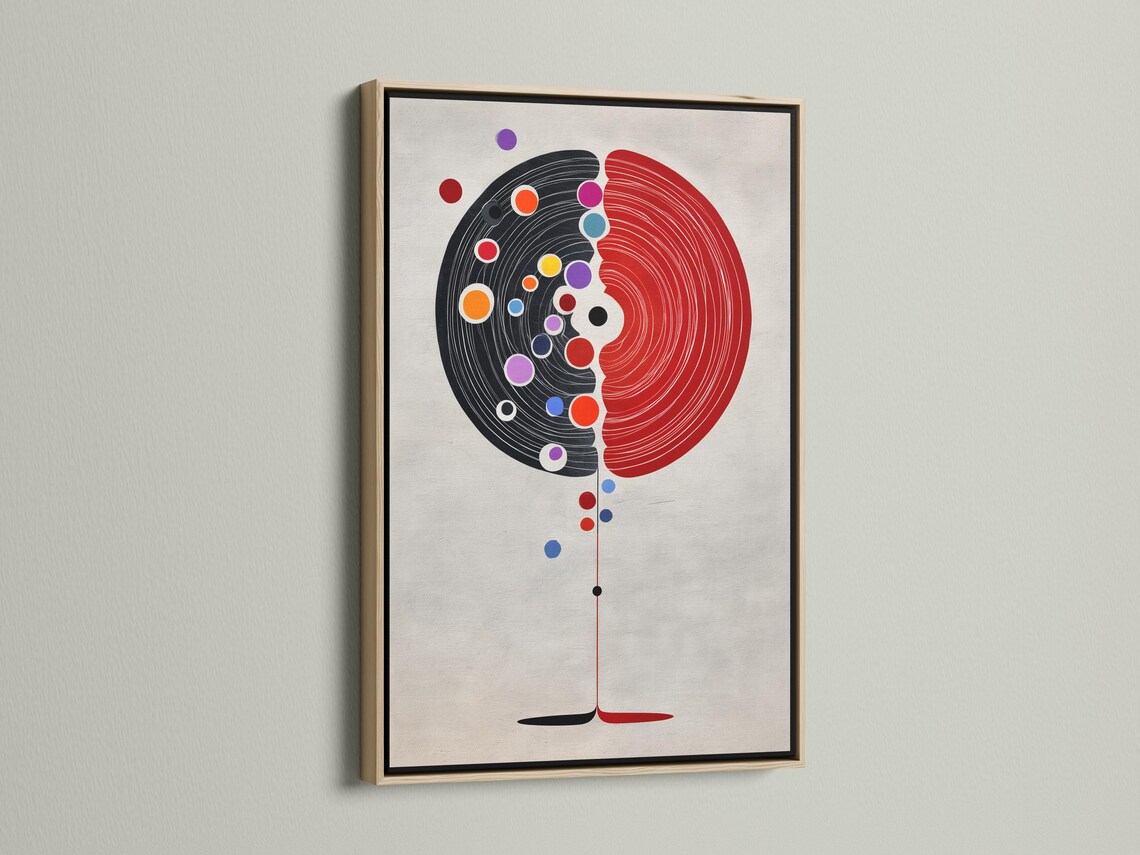 Abstract split circle design with red and black concentric arcs and colourful dot accents detail view