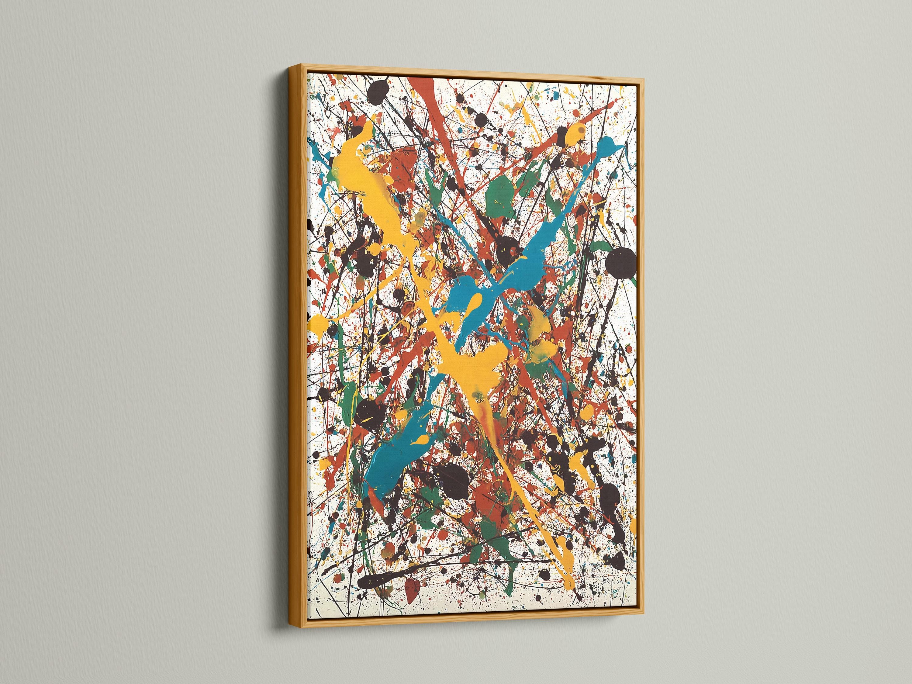 Abstract splatter artwork with layered blue, teal, yellow, red and green shapes on a white background detail view
